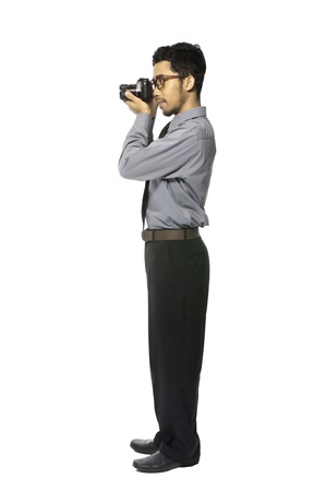 Young photographer take picture using analog SLR Cameraの写真素材