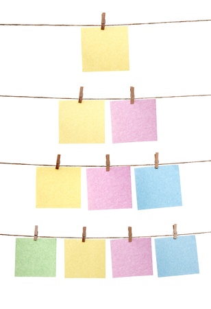 Collection of paper note hanging on the rope isolated over white backgroundの写真素材