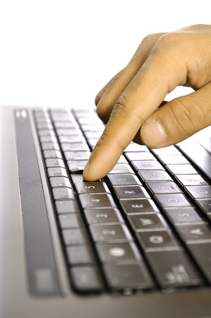Man touching laptop button. Shot with shallow DOFの写真素材
