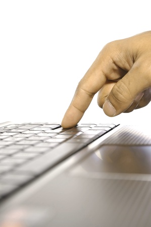 Man touching laptop button. Shot with shallow DOFの写真素材
