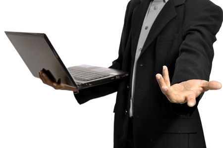 Business man give the hand for help using laptop isolated over white backgroundの写真素材