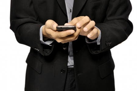 Close up of man using mobile smart phone isolated on white backgroundの写真素材