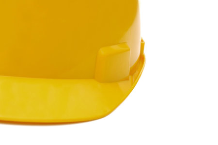 Yellow construction helmet isolated over white backgroundの写真素材
