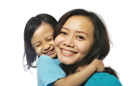 Portrait of happy mother and daughter isolated over white backgroundの写真素材