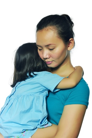 Portrait of happy mother and daughter isolated over white backgroundの写真素材