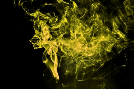 Abstract yellow smoke on black background  Good for your designの写真素材