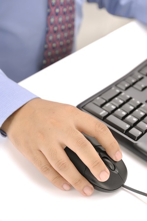 Male hand holding a mouse  This is working concept photoの写真素材