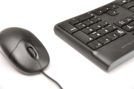 Computer mouse and keyboard on white backgroundの写真素材