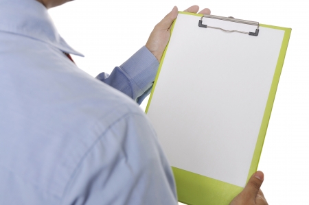 Businessman holding white paper on the clipboard. You can put your message on the paperの写真素材