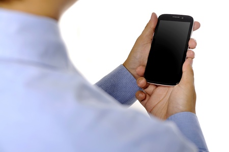 Business man holding smartphone isolated over white backgroundの写真素材