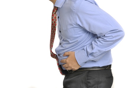 Image of man suffering stomach ache isolated over white backgroundの写真素材