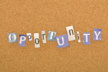 Opportunity word made from newspaper letter shot over pinboard backgroundの写真素材