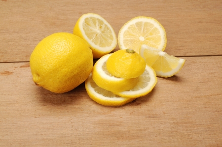 Lemon fruit shot with wooden texture backgroundの写真素材