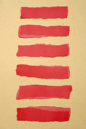 Collection of red paper tears, shot on brown backgroundの写真素材