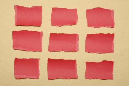 Collection of red paper tears, shot on brown backgroundの写真素材