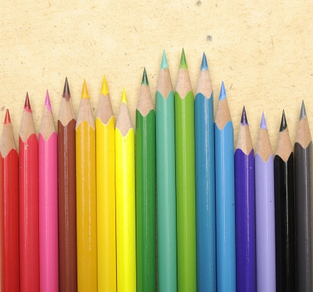 Color pencils shot on brown cardboard paperの写真素材