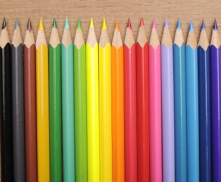 Colour pencils shot on wooden background close upの写真素材