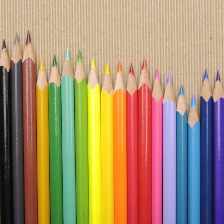 Color pencils shot on brown cardboard paperの写真素材