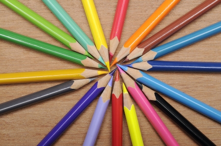 Colour pencils shot on wooden background close upの写真素材