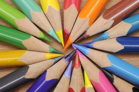 Colour pencils shot on wooden background close upの写真素材
