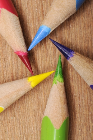 Colour pencils shot on wooden background close upの写真素材