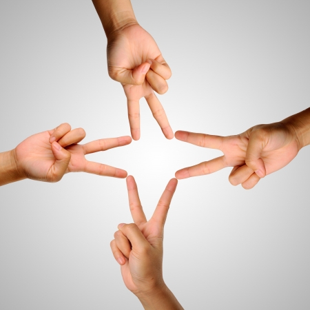 Hands showing the sign of victory and peace closeupの写真素材