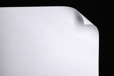 Sheet of paper folded onver black backgroundの写真素材