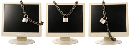 Set of computer monitor tied with chain. A computer security conceptの写真素材
