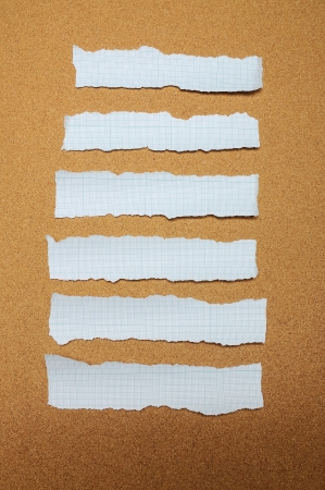 Set of blue torn piece of paper over brown backgroundの写真素材