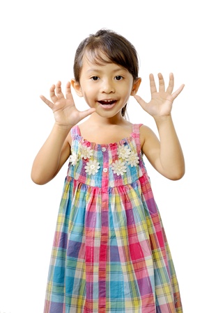 Happy little asian girl isolated over white backgroundの写真素材