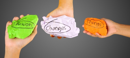 Action Changes Things concept. Human hands holding crumpled paper with Action Changes Things writingの写真素材
