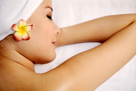 Beautiful asian woman relaxing after massage on the spa の写真素材