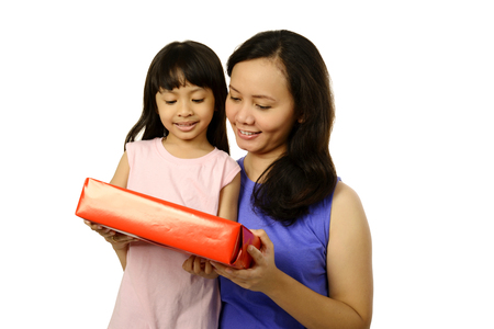 Picture of mother and daughter with gift box. Mothers day conceptの写真素材