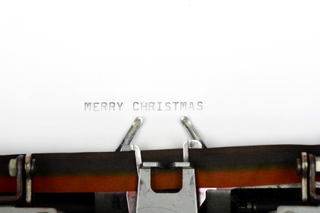 Merry christmas typing on paperの写真素材