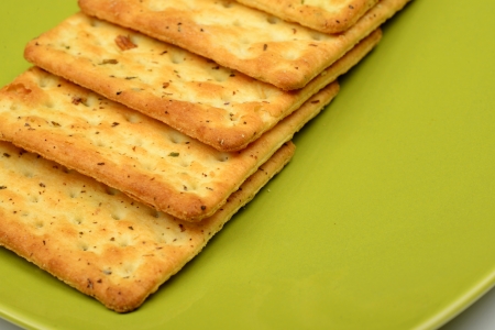 Biscuit or snack on the green bowl. Diet conceptの写真素材