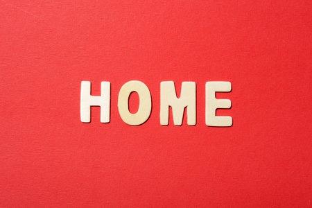 Home text on red paper backbroundの写真素材