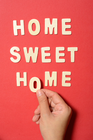 Home sweet home text on red paper backbroundの写真素材