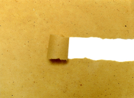 Brown torn paper with copyspace inside. You can put your message on the paperの写真素材