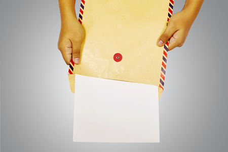 Human hand holding brown envelope. You can put your design hereの写真素材