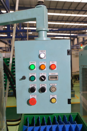 Control panel with buttons and levers in the factory