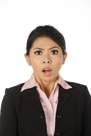 Asian business woman shocked isolated over white backgroundの写真素材