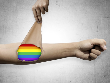 Hand open skin with LGBT flag inside. Freedom conceptualの写真素材