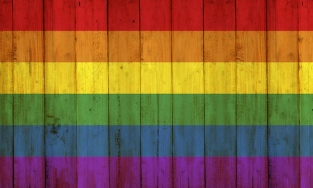 Gay flag rainbow on wooden fence texture. LGBT Conceptの写真素材