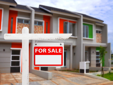 House for sale board with house background. You can put your number on the boardの写真素材