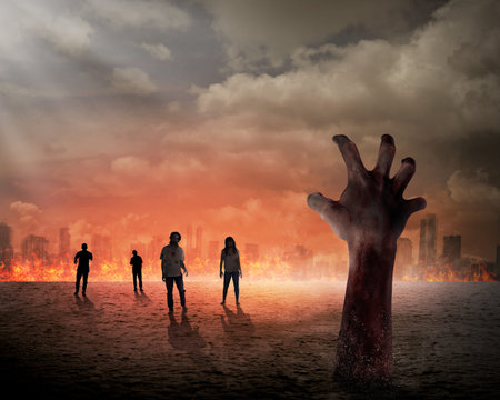 Halloween concept, zombie hand rising out from the ground