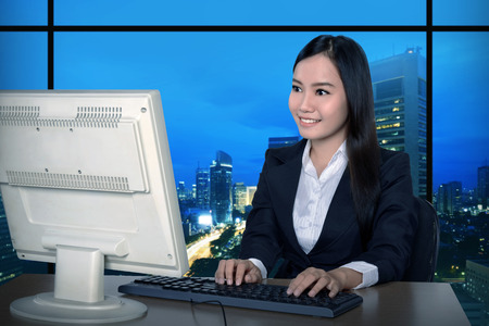 Business woman working late. Overtime conceptの写真素材