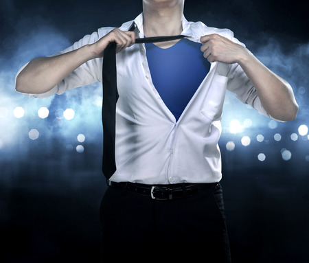Business man open shirt like superhero try saving the dayの写真素材