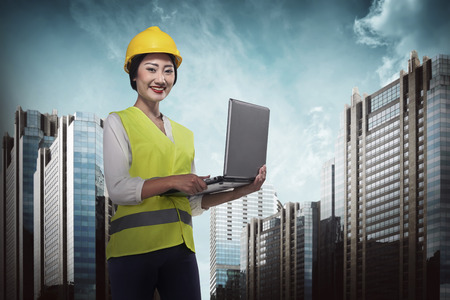 Asian engineer working with laptop. Industrial conceptの写真素材