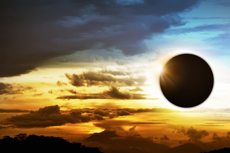 Total solar eclipse over the dark skyの写真素材
