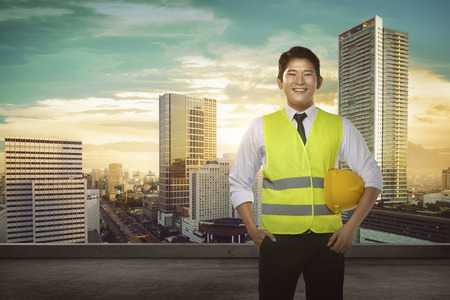 Asian engineer wearing safety vest. Industrial conceptの写真素材